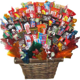 Basket filled with assorted candy bars and wrapped sweets