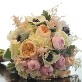 Pastel bouquet with cream, pink, and peach flowers
