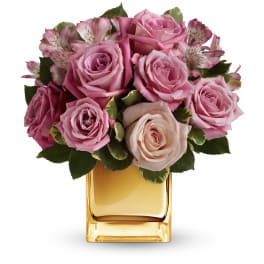 Pink roses and alstroemeria in a gold glass vase