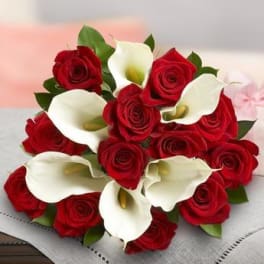 Bouquet of red roses and white calla lilies