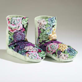 Pair of soft boot-style slippers with colorful succulent print
