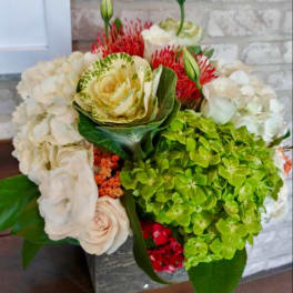 Mixed bouquet with white hydrangeas, roses, and green hydrangea blooms