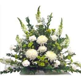 White and green sympathy floral spray with chrysanthemums and snapdragons