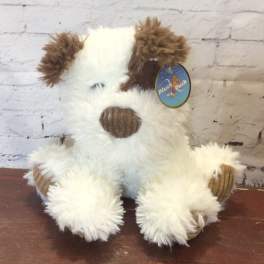 Plush dog toy with white fur and brown ears sitting upright