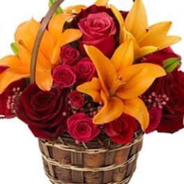Basket of red roses and orange lilies