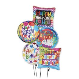 Cluster of colorful birthday balloons with printed messages
