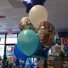 Cluster of Father’s Day balloons in blue, white, and patterned foil