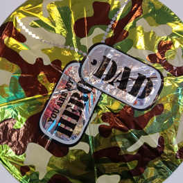 Camouflage-patterned round foil balloon with a "Dad" label