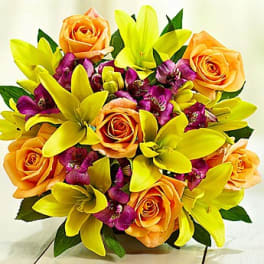 Bouquet of orange roses and yellow lilies with purple accents