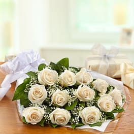Bouquet of cream roses with baby's breath and white ribbon