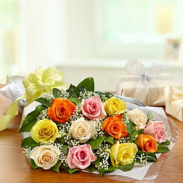 Bouquet of multicolored roses wrapped in clear paper