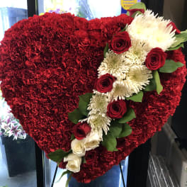 Heart-shaped red floral spray with white roses and red roses