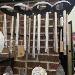 Hanging memorial wind chimes with engraved tubes and heart-shaped tags