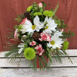White daisies and green mums with pink-edged carnations in a red pot