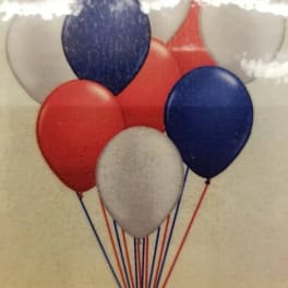 Cluster of red, white, and blue balloons with strings attached