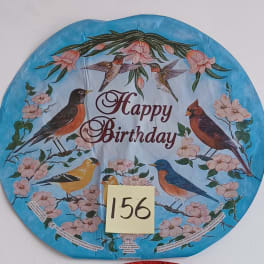 Round blue birthday balloon with birds and pink blossoms