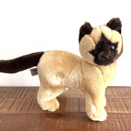 Plush cat figurine with tan fur and dark face and tail