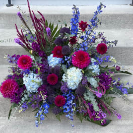 Large bouquet of blue, purple, and pink flowers
