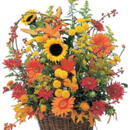 Autumn flower basket with sunflowers, lilies, and orange daisies