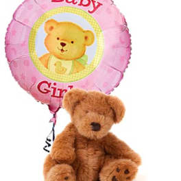Pink baby girl balloon with a teddy bear plush