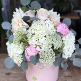 Pink and white bouquet in a pastel pink vase
