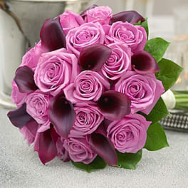 Pink rose bouquet with dark purple calla lilies