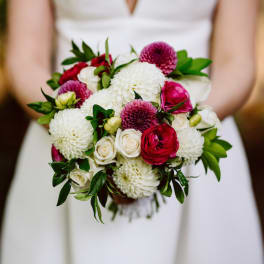 Bride holding a bouquet of white and pink flowers