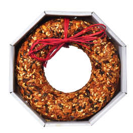 Ring-shaped seed cake in a box tied with a red ribbon