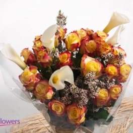 Bouquet of yellow and red roses with white calla lilies