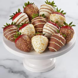 Plate of chocolate-covered strawberries on a white pedestal stand