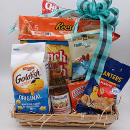 Gift basket of snacks and sparkling juice with a blue ribbon