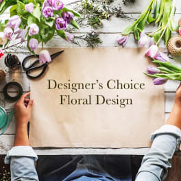 Designer’s Choice Floral Design sign surrounded by tulips and floral supplies