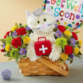 Basket of colorful flowers with a cat-shaped plush and a get well soon balloon