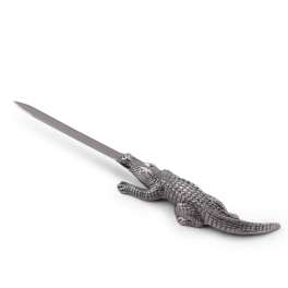 Metal alligator-shaped letter opener on a white background