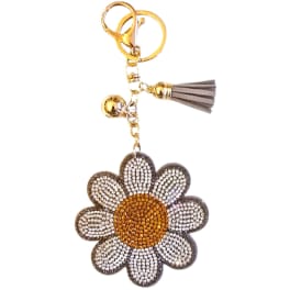 Daisy-shaped keychain with a rhinestone flower charm and tassel
