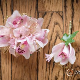 Pink orchid corsage and boutonniere with ribbon accents