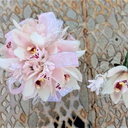 Pink and white orchid corsage and boutonniere with ribbon
