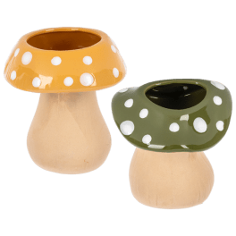 Two polka dot mushroom-shaped ceramic planters