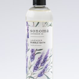 Bottle of lavender bubble bath with illustrated purple lavender sprigs on the label