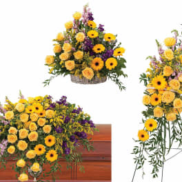 Set of yellow rose and daisy funeral arrangements with casket spray, basket, and standing spray.