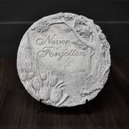 Round decorative plaque with tulips and the words Never Forgotten