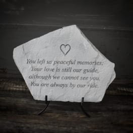 Memorial stone with an engraved sympathy verse and heart icon