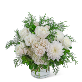 White roses and chrysanthemums in a clear glass vase