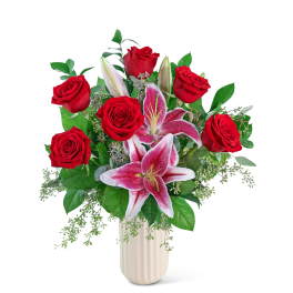 Red roses and pink lilies in a white vase