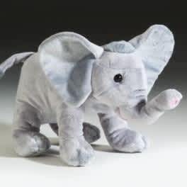 Small gray plush elephant toy with large ears and raised trunk.