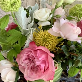 Pink and white mixed bouquet with roses and chrysanthemums in a vase