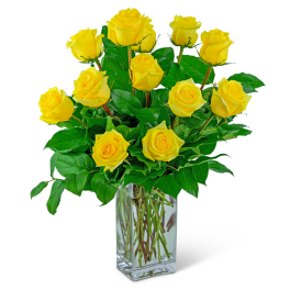 Yellow roses arranged in a clear glass vase