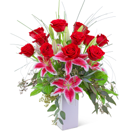 Red roses and pink lilies in a white vase