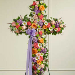 Cross-shaped floral spray with a lavender ribbon