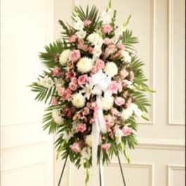 Standing floral spray with pink and white flowers on an easel